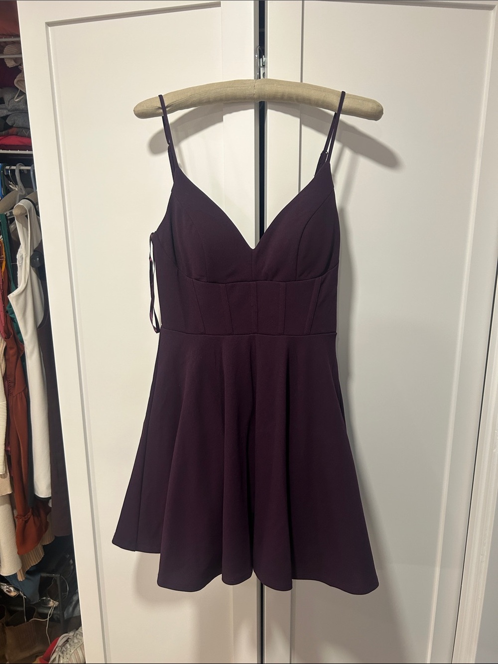 Adorable fit and flare low back corset mini dress with bow